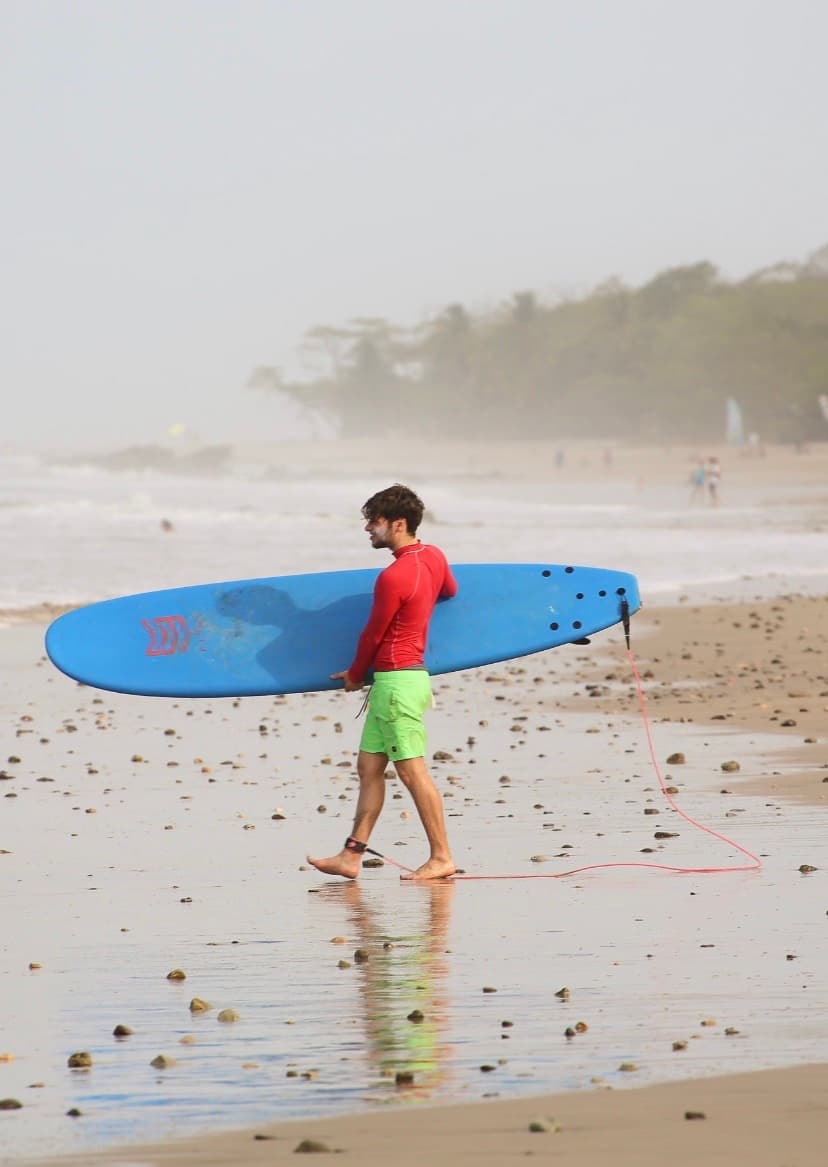 Walking out with a surfboard